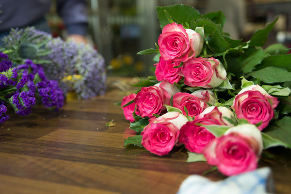 Leckey & Golden florists roses on table